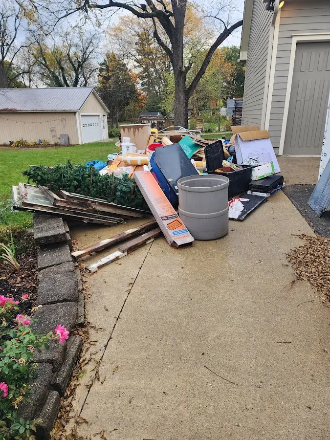 Dumpster being loaded with debris for 3 Yard Dumpster Rental in Ada